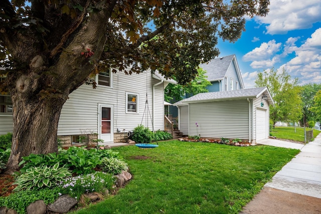 1144 Abell St, Saint Paul, MN 55117 - view of property exterior with a lawn, an outbuilding, and a garage