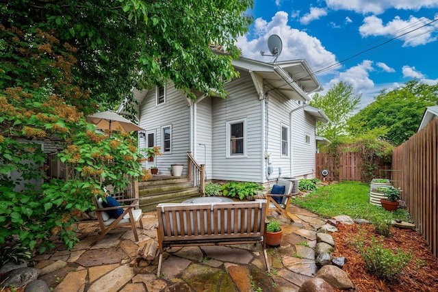 1144 Abell St, Saint Paul, MN 55117 - back of house with a fenced backyard and a patio