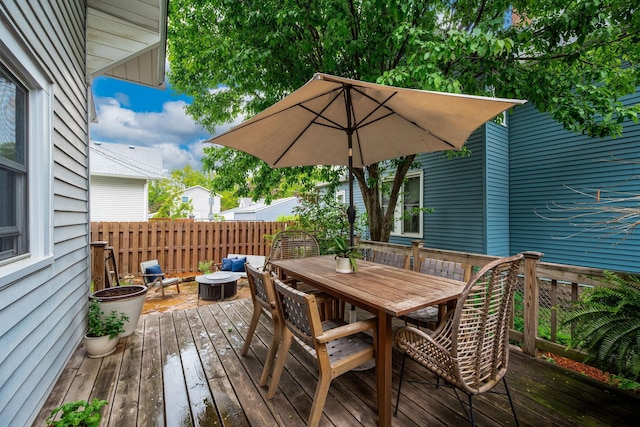 1144 Abell St, Saint Paul, MN 55117 - deck with outdoor dining area and an outdoor fire pit