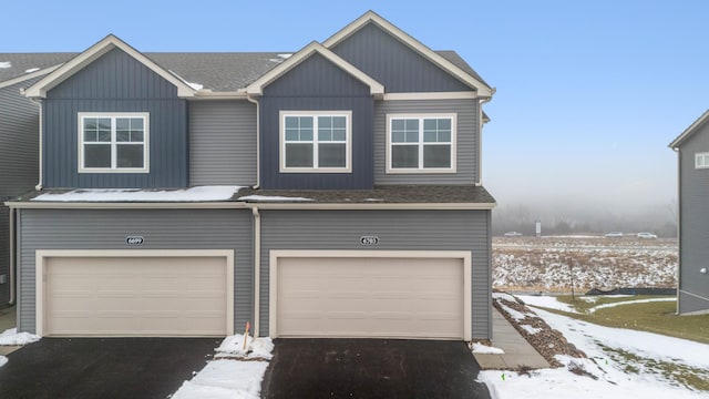 6687 Bluestem Way, Minnetrista, MN 55331 - view of front of house featuring a garage and asphalt driveway