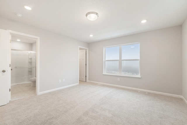 6687 Bluestem Way, Minnetrista, MN 55331 - unfurnished bedroom with light colored carpet, baseboards, recessed lighting, and ensuite bath
