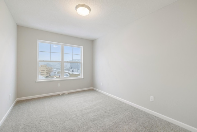6687 Bluestem Way, Minnetrista, MN 55331 - unfurnished room featuring carpet and baseboards