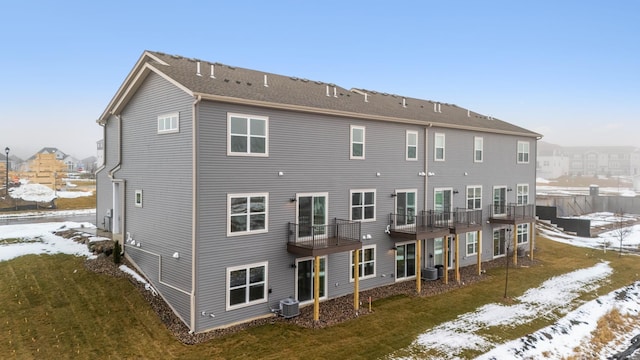 6687 Bluestem Way, Minnetrista, MN 55331 - snow covered back of property with cooling unit and a yard