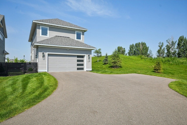 16149 Duvane Way, Lakeville, MN 55044 - view of front facade featuring driveway, roof with shingles, and a garage