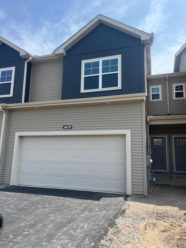 6679 Bluestem Way, Minnetrista, MN 55331 - view of front facade with an attached garage and driveway