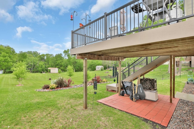 1217 Blossom Blvd NW, Isanti, MN 55040 - view of grassy yard featuring a patio area and an outdoor structure
