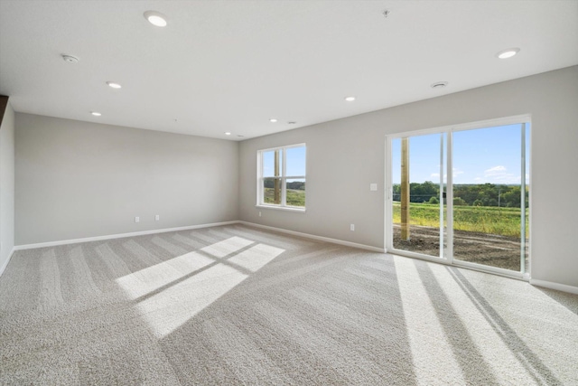 6683 Bluestem Way, Minnetrista, MN 55331 - unfurnished room featuring light carpet, baseboards, recessed lighting, a pendent fire sprinkler, and a smoke detector