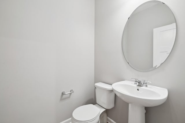 6683 Bluestem Way, Minnetrista, MN 55331 - half bathroom featuring toilet and baseboards