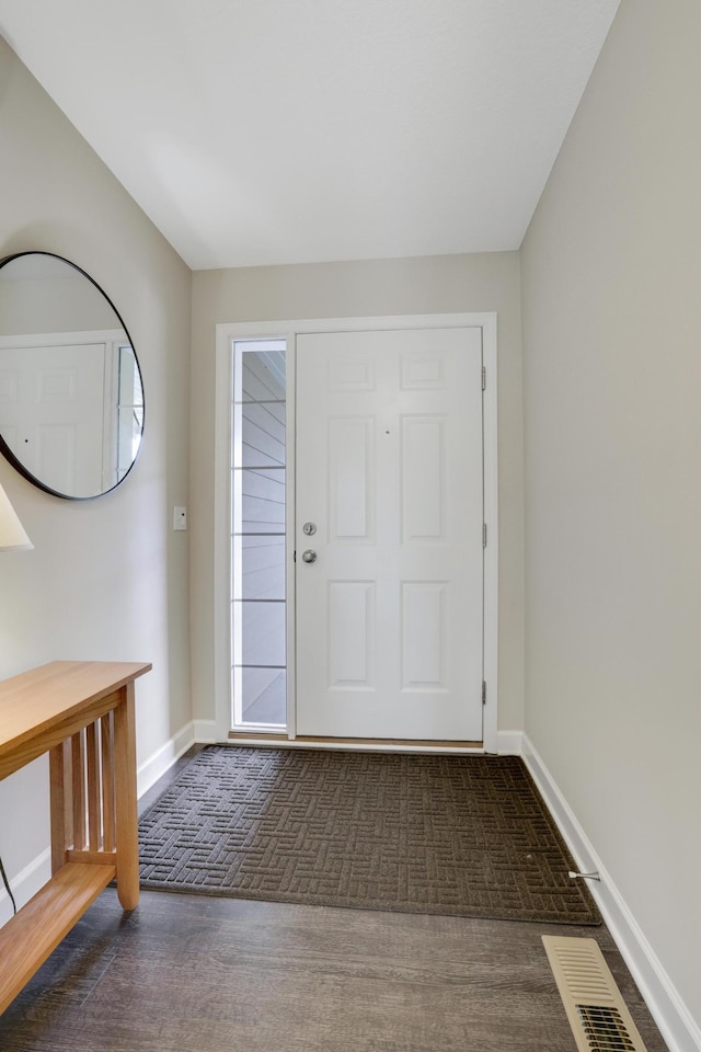 14246 Wilds Dr NW, Prior Lake, MN 55372 - foyer entrance featuring dark colored carpet and baseboards
