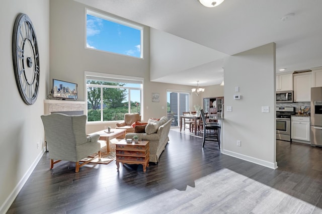 14246 Wilds Dr NW, Prior Lake, MN 55372 - living room with a chandelier, wood finished floors, and a high ceiling