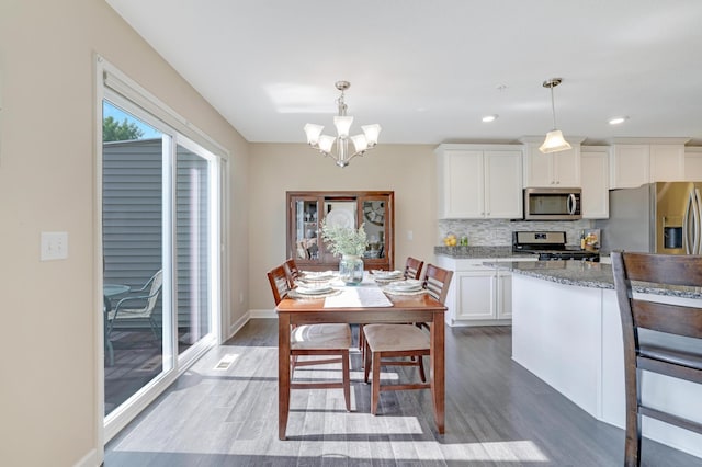 14246 Wilds Dr NW, Prior Lake, MN 55372 - dining room featuring wood finished floors, a chandelier, and recessed lighting