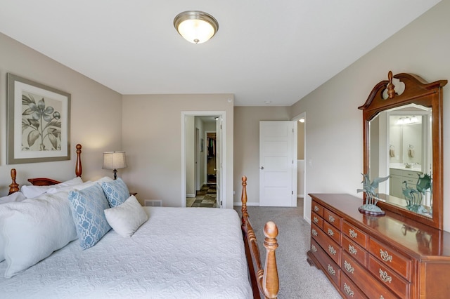 14246 Wilds Dr NW, Prior Lake, MN 55372 - carpeted bedroom with baseboards and ensuite bath
