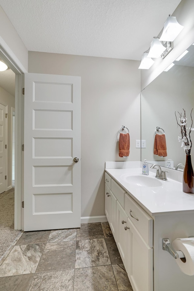 14246 Wilds Dr NW, Prior Lake, MN 55372 - bathroom with vanity and a textured ceiling