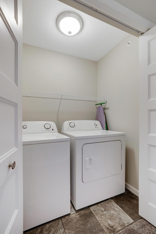 14246 Wilds Dr NW, Prior Lake, MN 55372 - washroom with washing machine and clothes dryer and stone finish floors