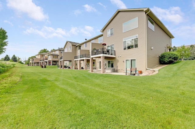14246 Wilds Dr NW, Prior Lake, MN 55372 - back of property with a lawn, a patio, and a balcony