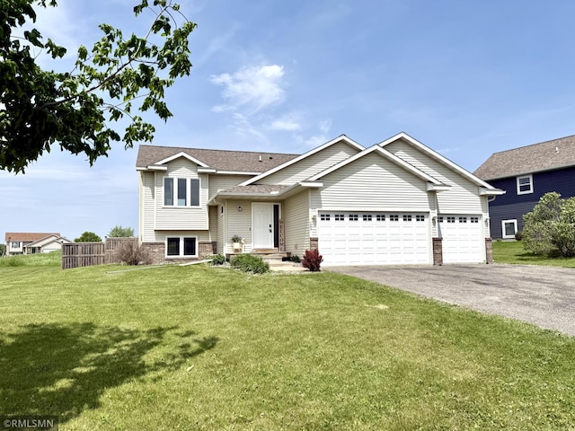 103 Highview Dr, Dassel, MN 55325 - split level home with driveway, an attached garage, a shingled roof, and brick siding