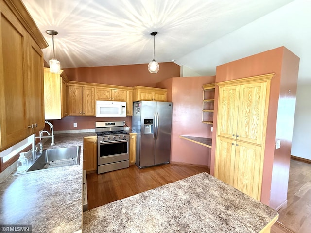 103 Highview Dr, Dassel, MN 55325 - kitchen with appliances with stainless steel finishes, light wood-style floors, lofted ceiling, a sink, and pendant lighting