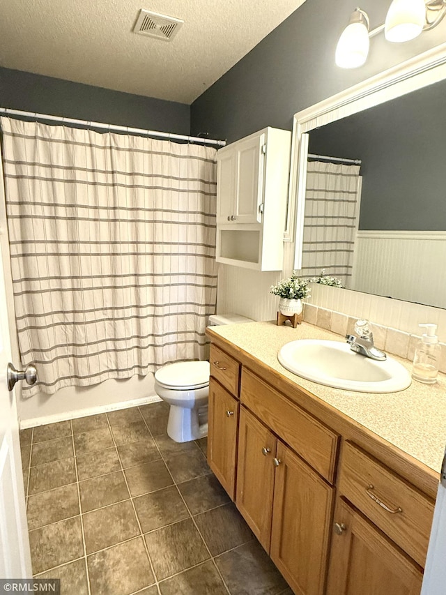 103 Highview Dr, Dassel, MN 55325 - full bathroom featuring vanity, toilet, a textured ceiling, shower / bath combo, and tile patterned floors
