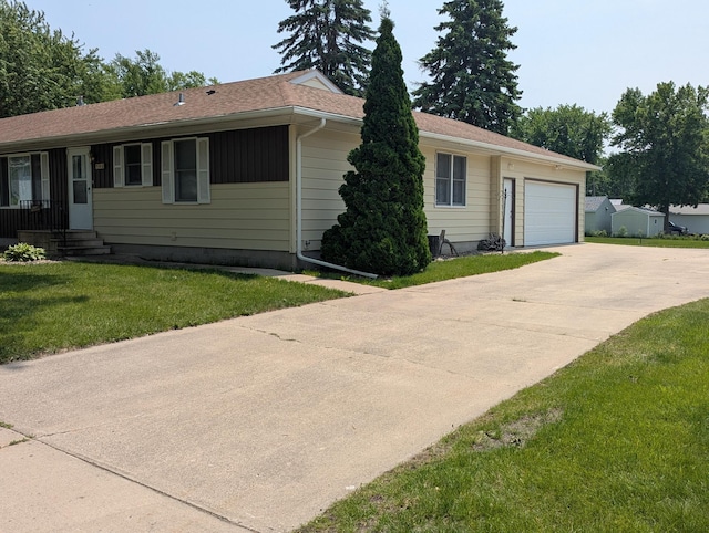 702 Hills Ln, Albert Lea, MN 56007 - ranch-style house with driveway, a garage, and a front yard