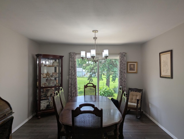 702 Hills Ln, Albert Lea, MN 56007 - dining space featuring a chandelier, dark wood finished floors, and baseboards