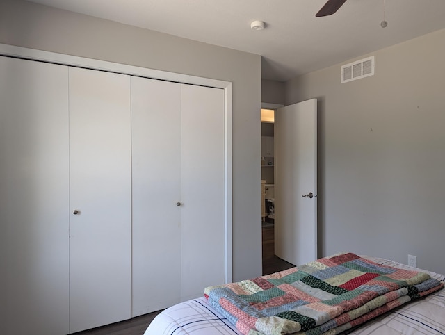 702 Hills Ln, Albert Lea, MN 56007 - bedroom with a closet, wood finished floors, and a ceiling fan
