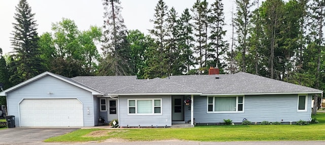 505 Lindquist St W, Onamia, MN 56359 - ranch-style house featuring a garage, asphalt driveway, a front lawn, a chimney, and roof with shingles