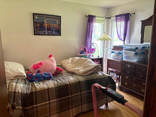 505 Lindquist St W, Onamia, MN 56359 - bedroom featuring wood finished floors