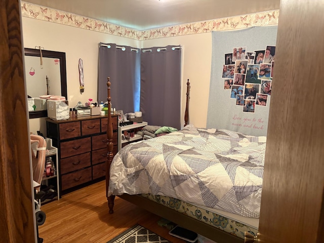 505 Lindquist St W, Onamia, MN 56359 - bedroom featuring wood finished floors