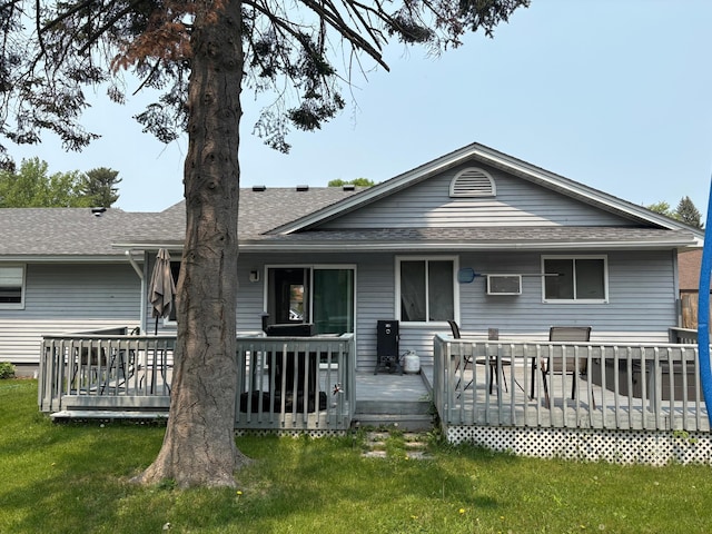 505 Lindquist St W, Onamia, MN 56359 - back of house with roof with shingles, a yard, and a wooden deck