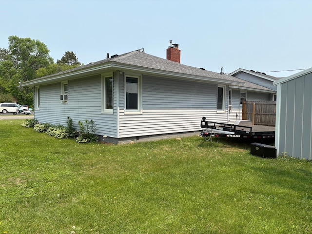 505 Lindquist St W, Onamia, MN 56359 - view of property exterior featuring a yard, a chimney, and roof with shingles