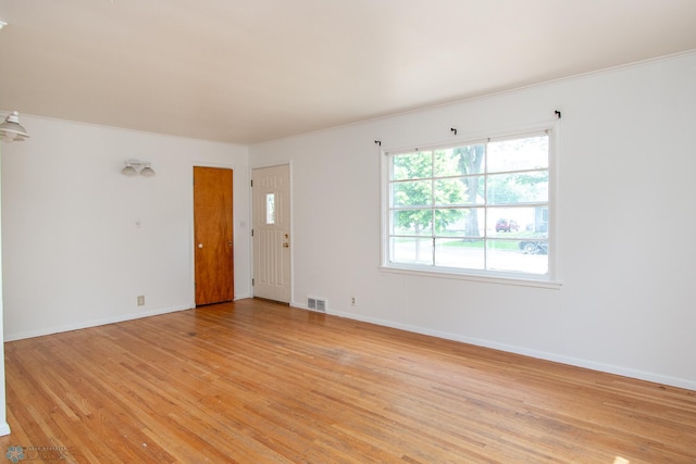 1614 2nd St N, Fargo, ND 58102 - empty room with light wood-style floors, ornamental molding, and baseboards