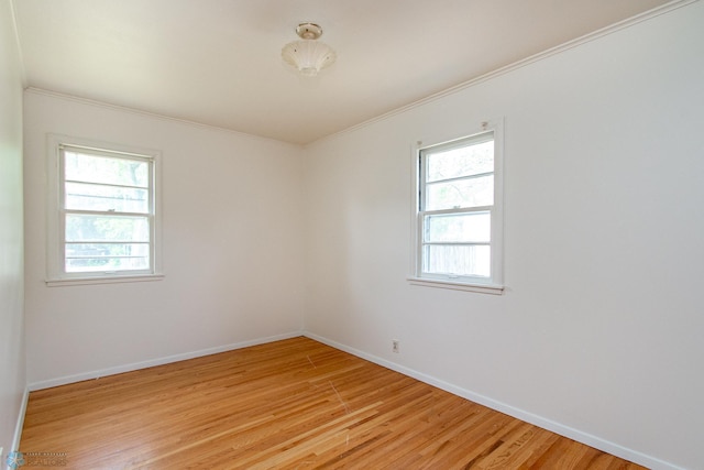 1614 2nd St N, Fargo, ND 58102 - empty room with light wood finished floors, ornamental molding, and baseboards