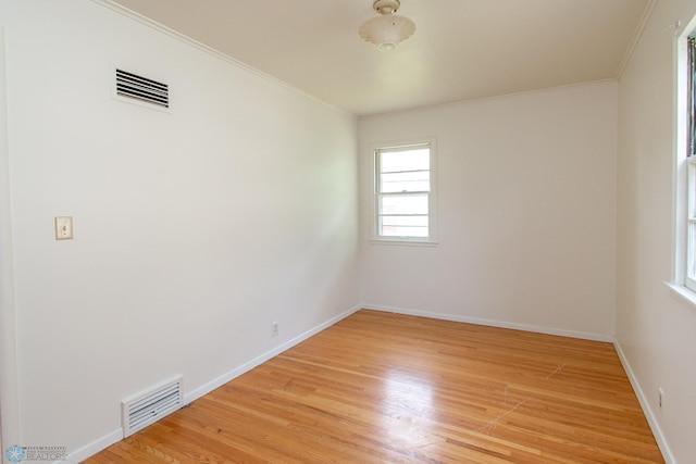 1614 2nd St N, Fargo, ND 58102 - empty room with light wood-style floors, ornamental molding, and baseboards
