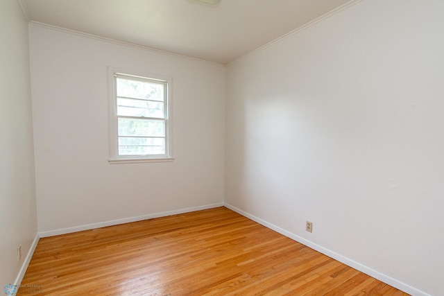 1614 2nd St N, Fargo, ND 58102 - empty room featuring ornamental molding, light wood-type flooring, and baseboards