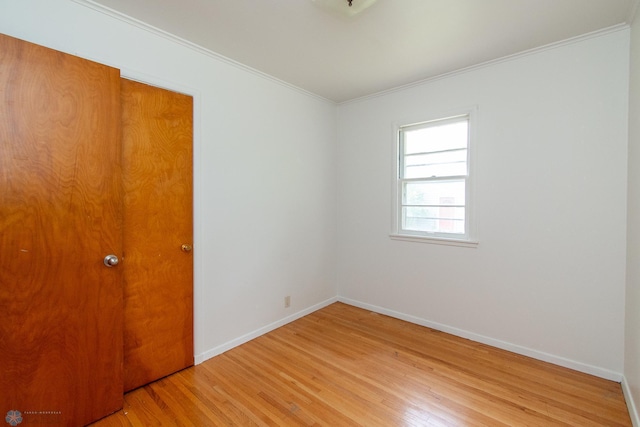1614 2nd St N, Fargo, ND 58102 - unfurnished room with light wood-style flooring, crown molding, and baseboards