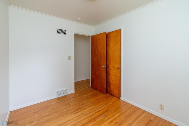1614 2nd St N, Fargo, ND 58102 - unfurnished room featuring light wood-style floors, crown molding, and baseboards