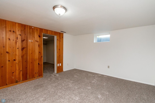 1614 2nd St N, Fargo, ND 58102 - basement featuring carpet, wood walls, and baseboards