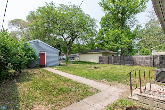 1614 2nd St N, Fargo, ND 58102 - view of yard with central AC unit and an outdoor fire pit