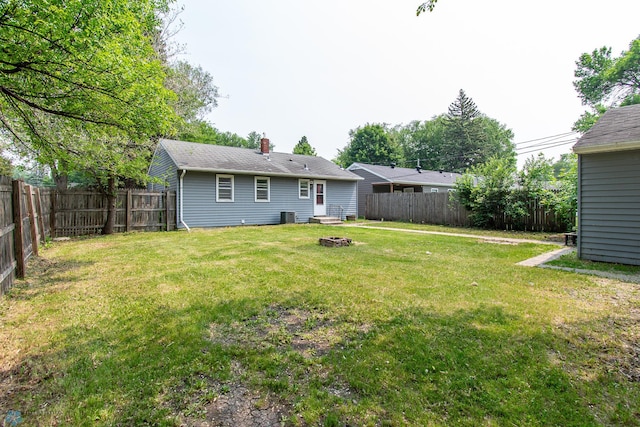 1614 2nd St N, Fargo, ND 58102 - view of yard featuring an outdoor fire pit and central AC unit