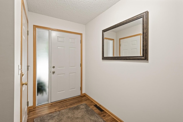 13408 Ximines Ln N, Champlin, MN 55316 - entrance foyer with dark wood-type flooring and a textured ceiling