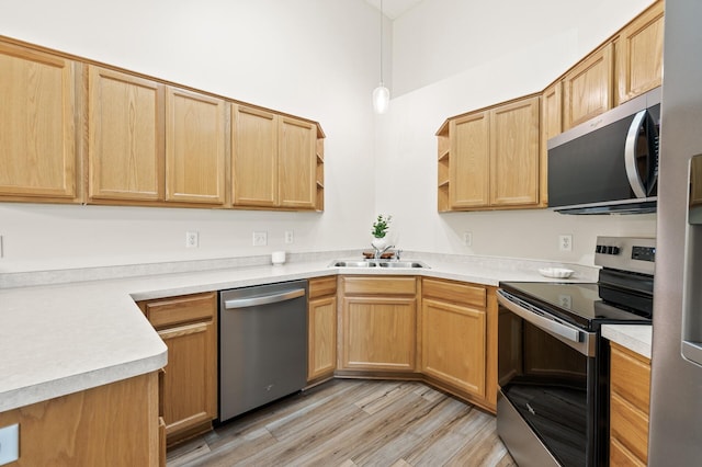 13408 Ximines Ln N, Champlin, MN 55316 - kitchen with stainless steel appliances, open shelves, light wood-style floors, and light countertops
