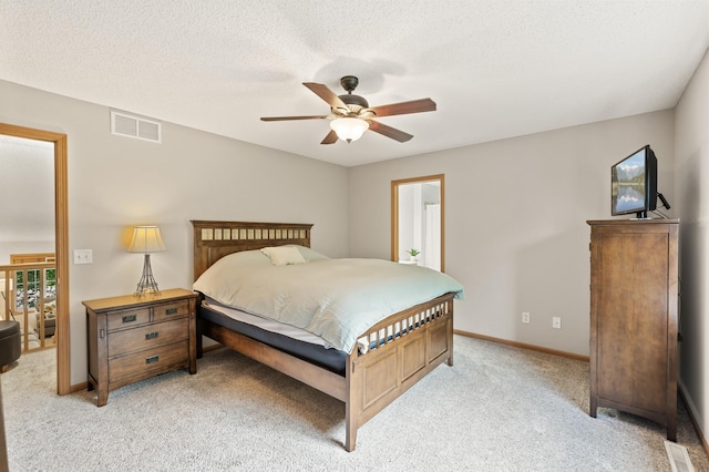 13408 Ximines Ln N, Champlin, MN 55316 - bedroom with light colored carpet and ceiling fan