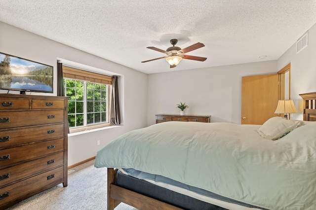 13408 Ximines Ln N, Champlin, MN 55316 - bedroom featuring light carpet, a textured ceiling, and a ceiling fan