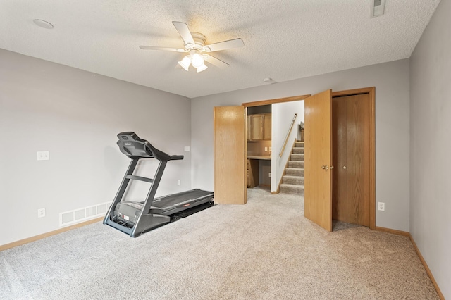 13408 Ximines Ln N, Champlin, MN 55316 - workout area with ceiling fan, light colored carpet, and a textured ceiling