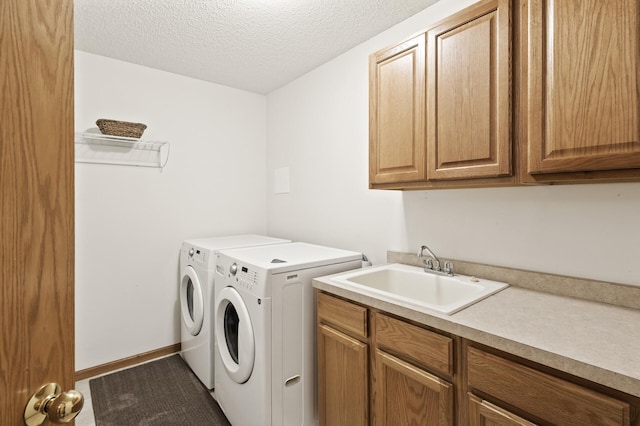 13408 Ximines Ln N, Champlin, MN 55316 - laundry room featuring cabinet space, washing machine and dryer, a textured ceiling, and carpet floors