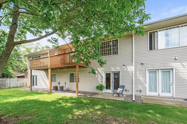 13408 Ximines Ln N, Champlin, MN 55316 - rear view of house featuring a deck and a patio area