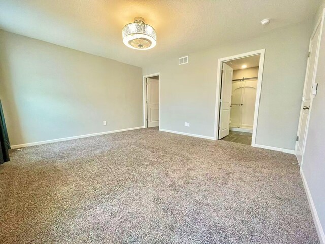 8521 Titanium Cir, Woodbury, MN 55129 - unfurnished bedroom featuring carpet floors, baseboards, and ensuite bathroom