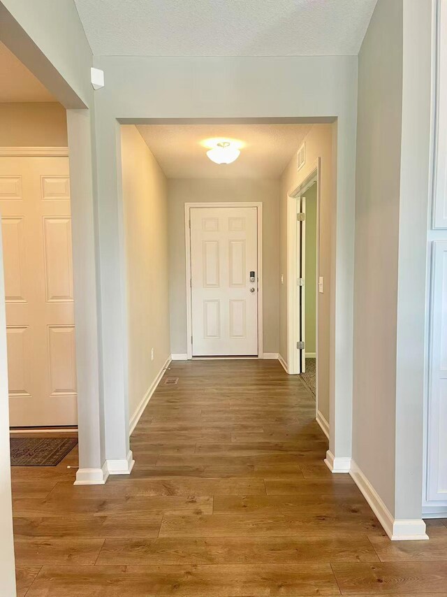 8521 Titanium Cir, Woodbury, MN 55129 - hall with wood finished floors and baseboards