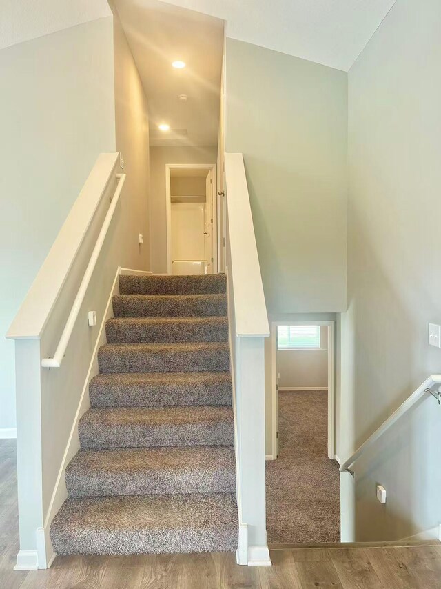 8521 Titanium Cir, Woodbury, MN 55129 - staircase featuring baseboards and wood finished floors