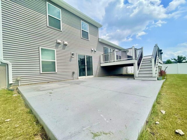 8521 Titanium Cir, Woodbury, MN 55129 - back of house featuring a patio, a deck, and stairway